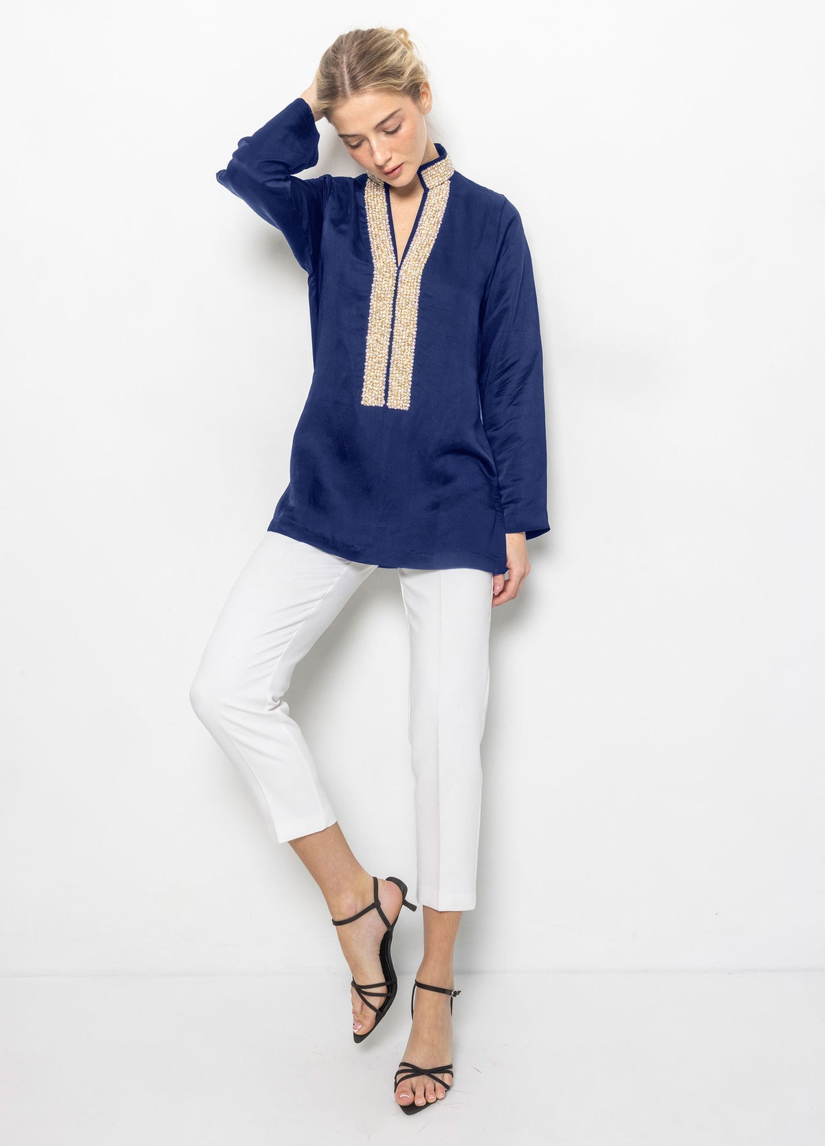 Pearl Tunic in Navy, front view, one arm raised