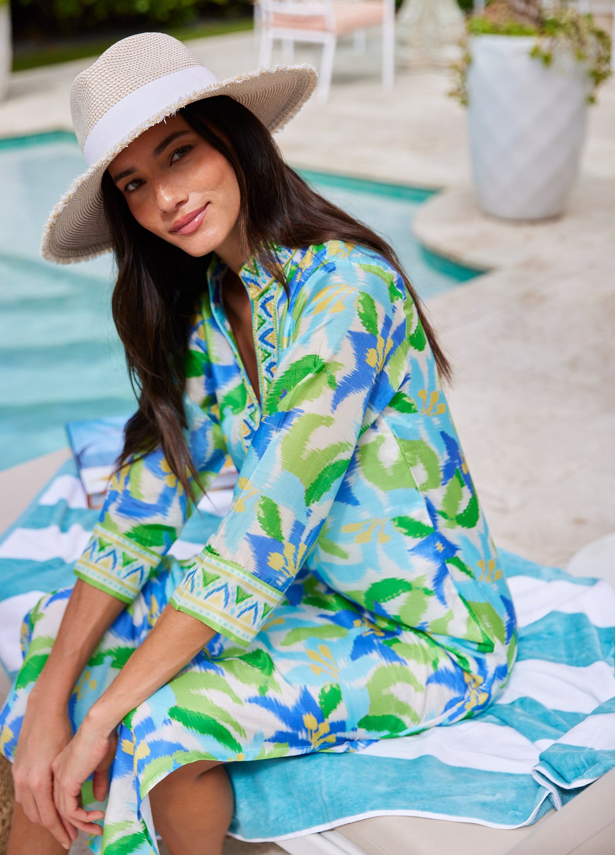 Elise Caftan in Lily Blue, seated by the pool