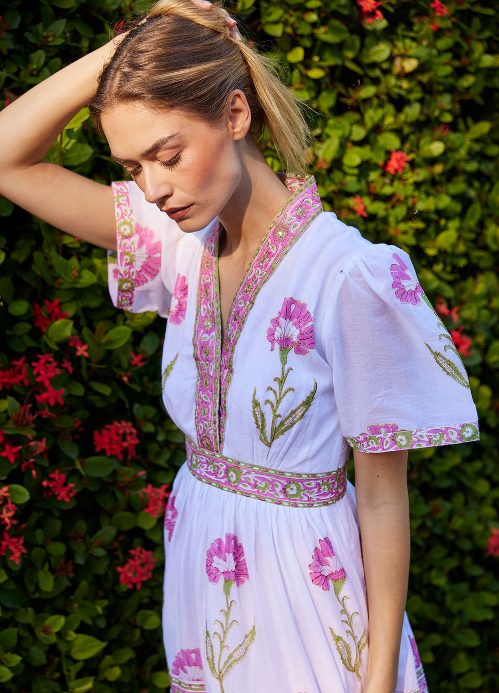 Erin Dress in Nicole Pink, closer view, arm raised