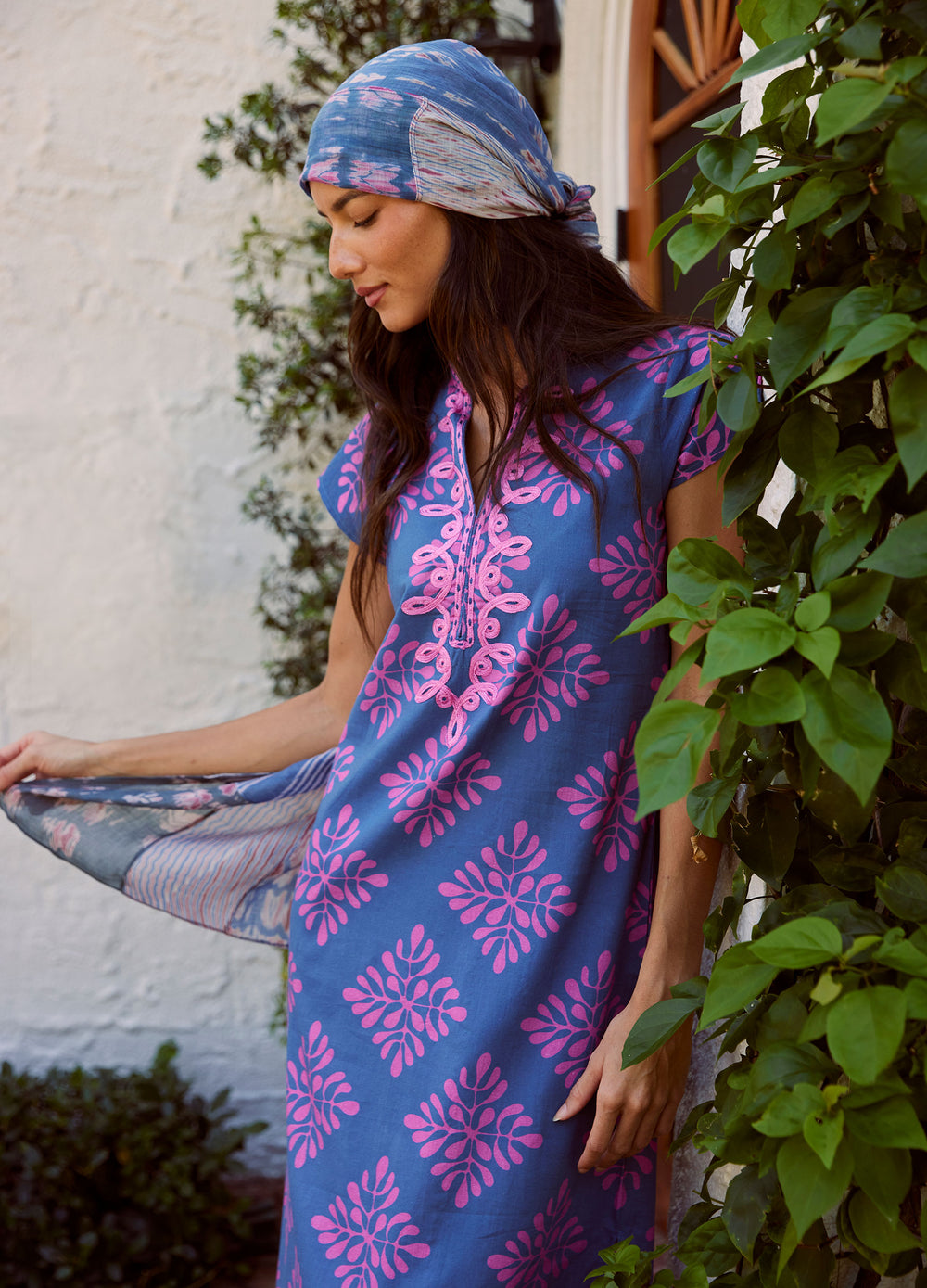 Lana Cap Sleeve Caftan in Diamond Print Navy, looking down by climbing vines