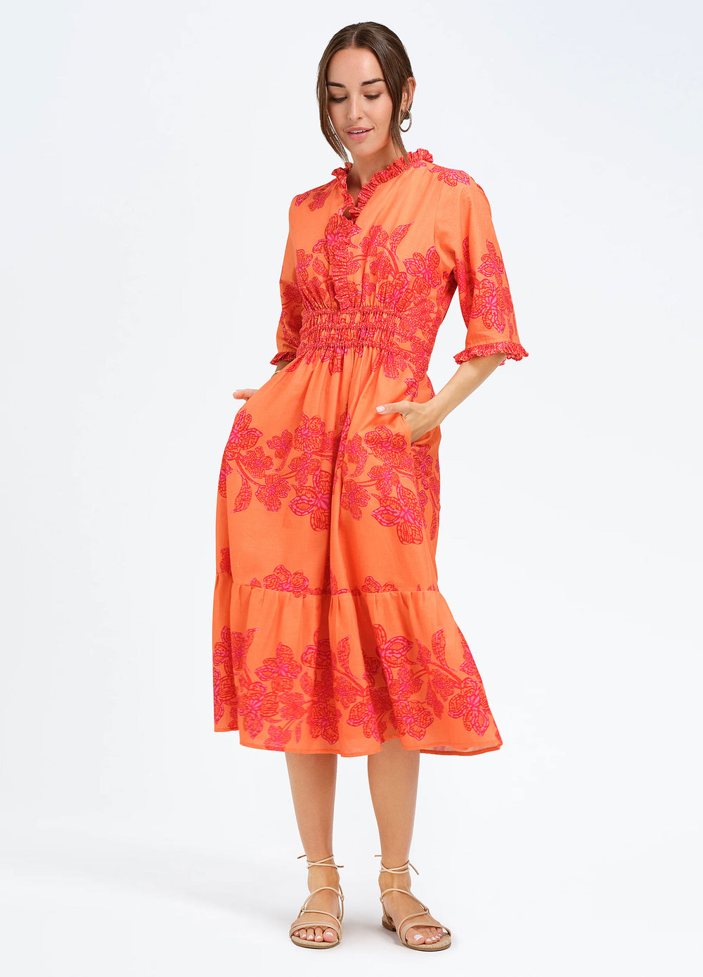 Daphne Dress in Flora Coral, front view, hands in pockets