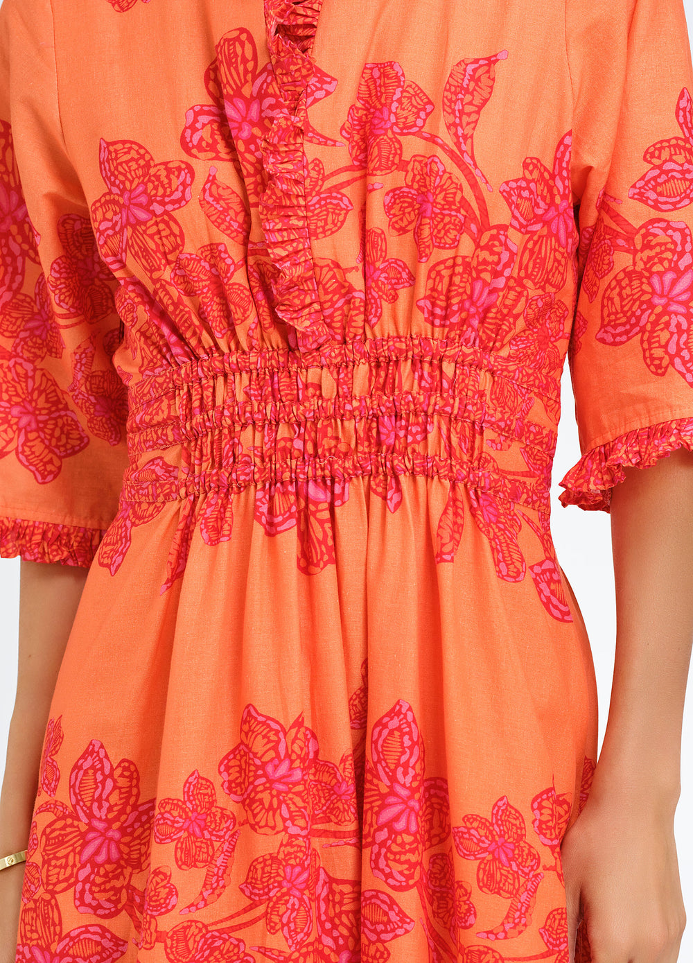 Daphne Dress in Flora Coral, close-up of the smocked waist