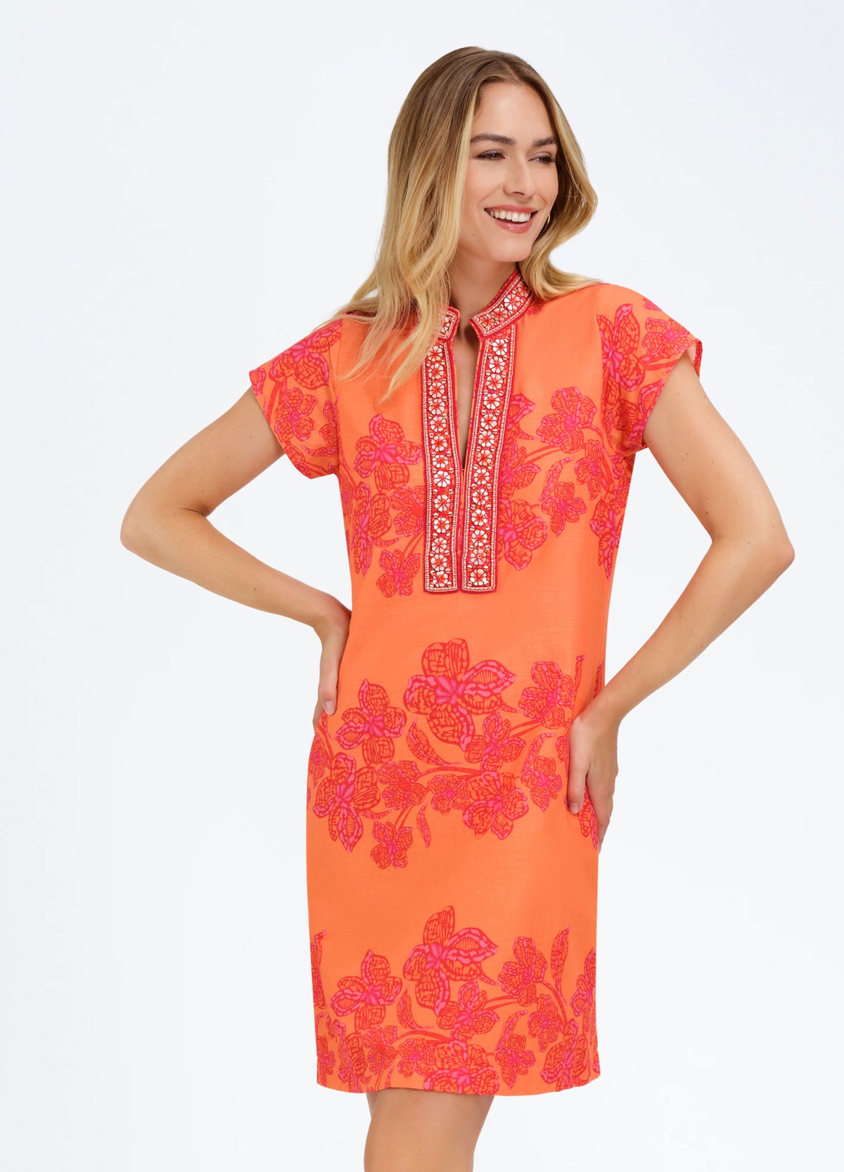 Eli Dress in Flora Coral, closer front view, hands on hips
