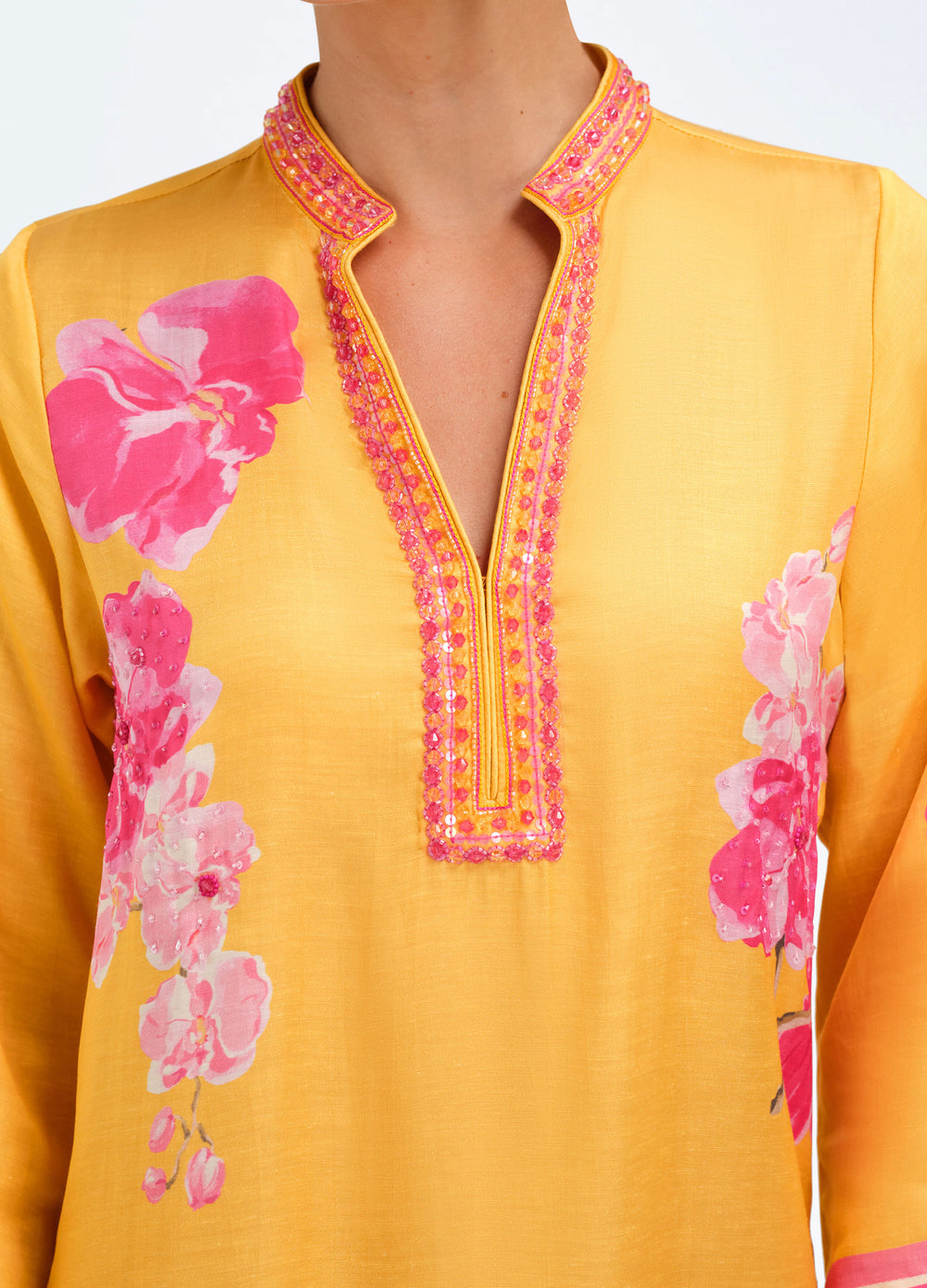 Elise Caftan in Orchid Melon, close-up of the beaded neckline