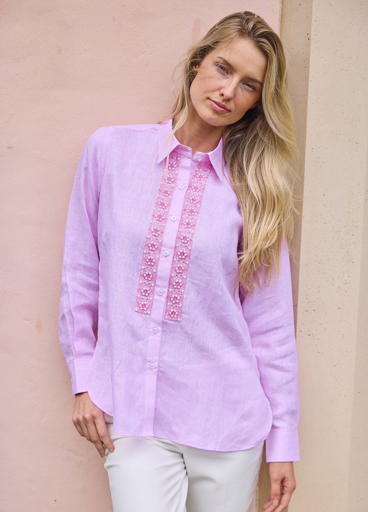 Pearl Flower Shirt in Pink, front view, leaning on a wall