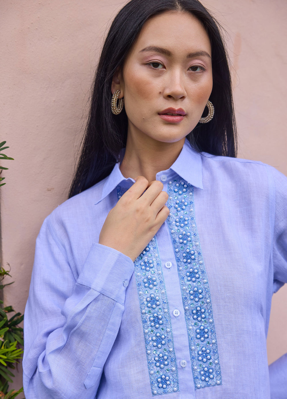Pearl Flower Shirt in Blue, closer view, hand at the collar