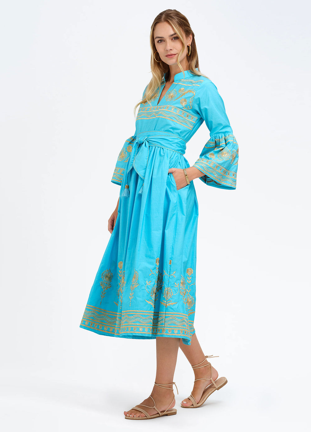 Elena Dress in Turquoise, three-quarter view, hand in pocket
